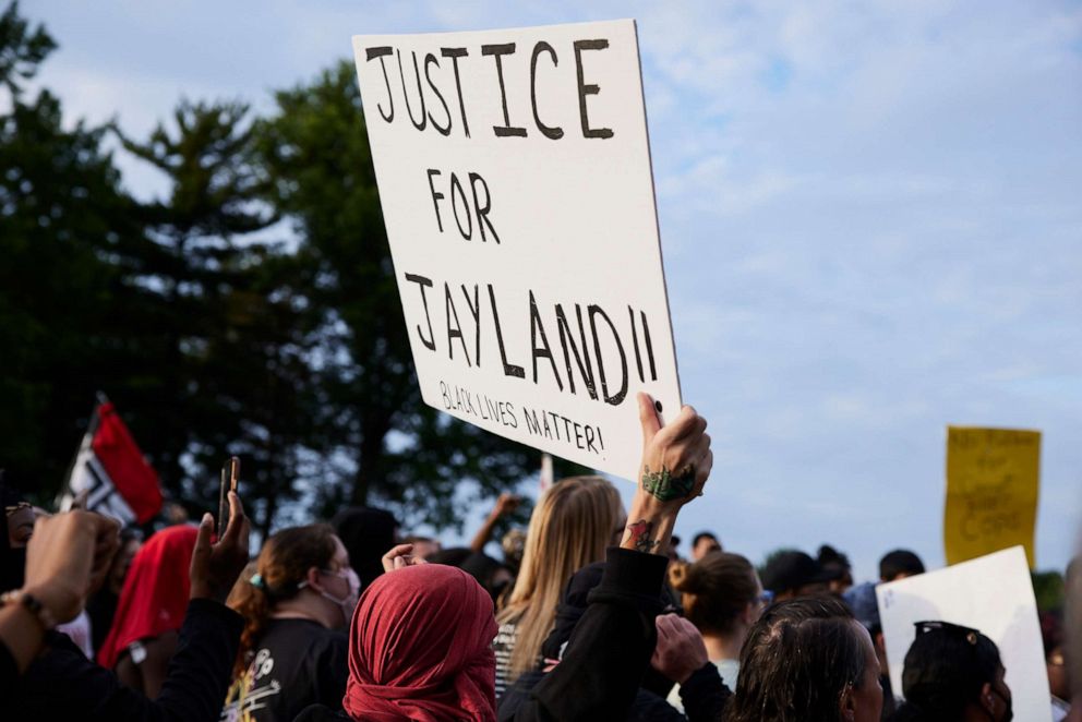 PHOTO: In this July 8, 2022, file photo, a demonstrator holds a sign during a vigil in honor of Jayland Walker in Akron, Ohio. Walker was shot and killed by members of the Akron Police Department on July 3, 2022.