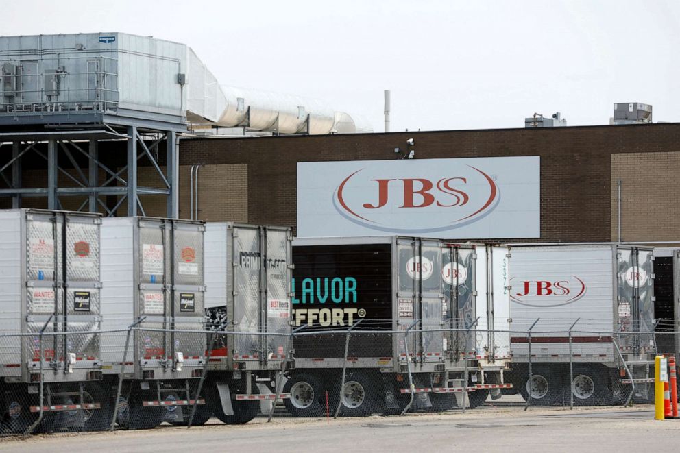 PHOTO: Trucks are parked outside the JBS meat plant in Plainwell, Michigan, June 2, 2021.