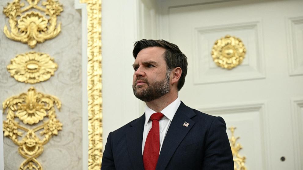 PHOTO: Vice President JD Vance listens to President Donald Trump speak in the Oval Office of the White House in Washington, Aug. 6, 2025.