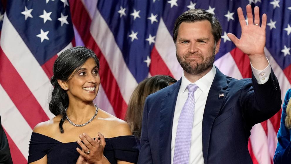 PHOTO: Republican vice presidential nominee Sen. JD Vance, waves as his wife Usha Vance looks on at an election night watch party, Nov. 6, 2024, in West Palm Beach, Fla. 