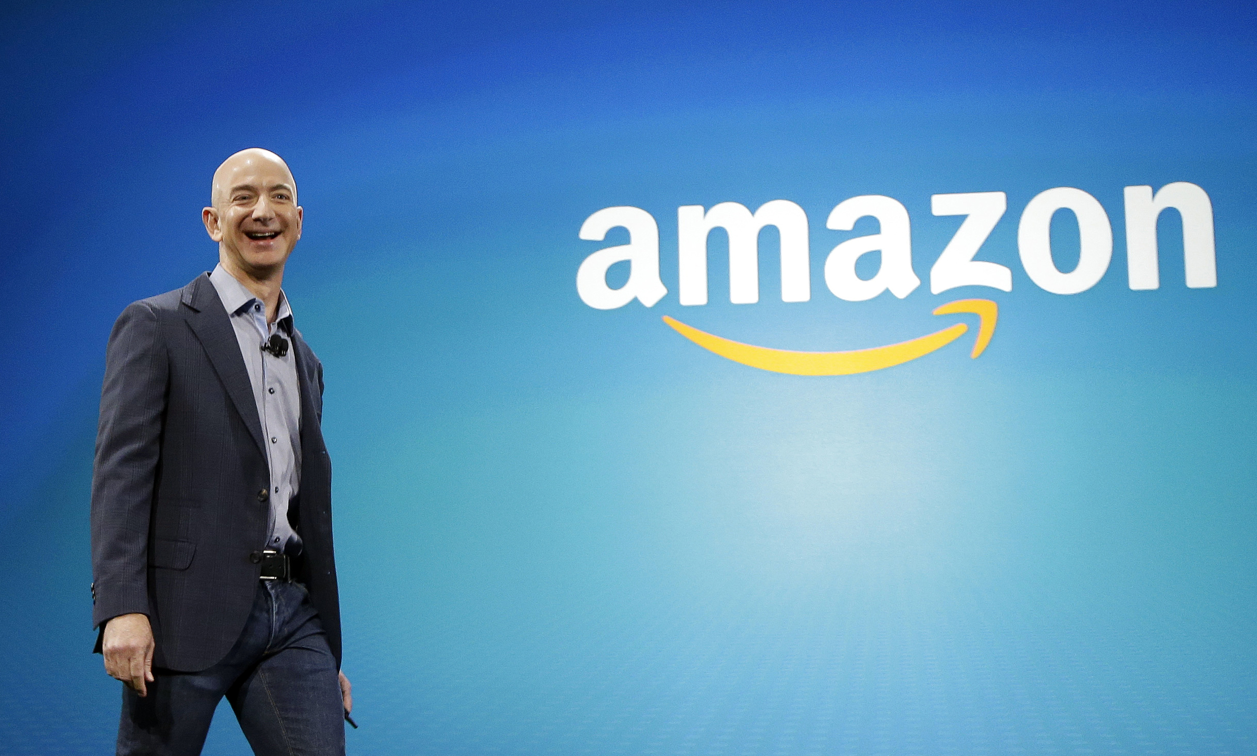 PHOTO: Amazon CEO Jeff Bezos walks onstage for the launch of the new Amazon Fire Phone, in Seattle, June 16, 2014.