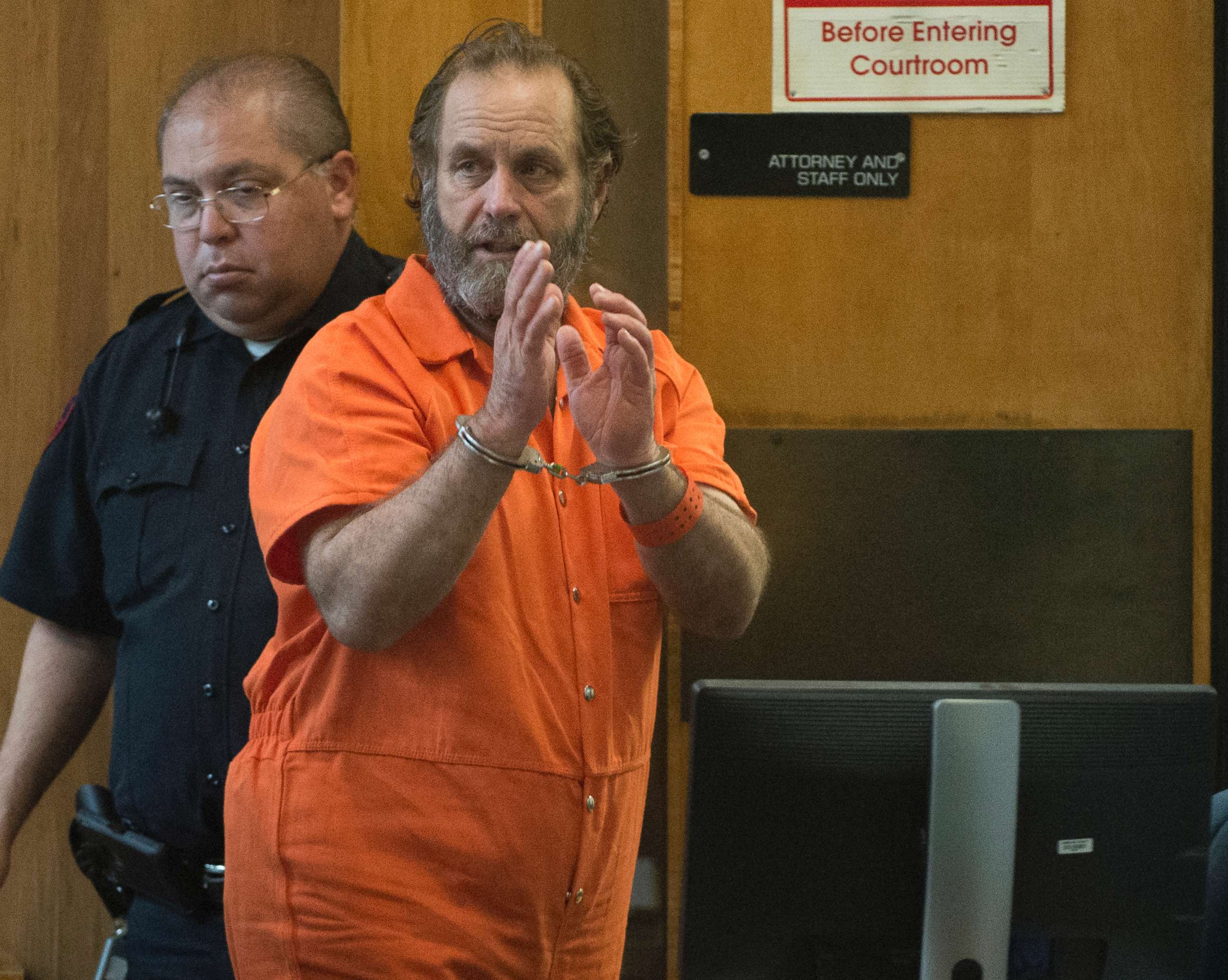 PHOTO: Schlitterbahn co-owner Jeffrey Wayne Henry waves before departing the courtroom following an extradition hearing, March 28, 2018, in the 107th state District Courtroom in Brownsville, Texas.