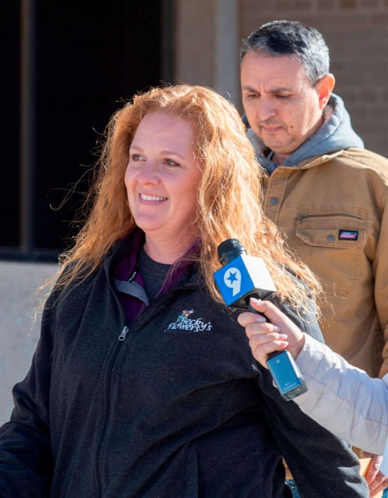 PHOTO: Jenny Cudd, front, a flower shop owner and former Midland mayoral candidate, leave the federal courthouse in Midland, Texas, Jan. 13, 2021. More than 125 people have been arrested so far on charges related to the insurrection at the U.S. Capitol.