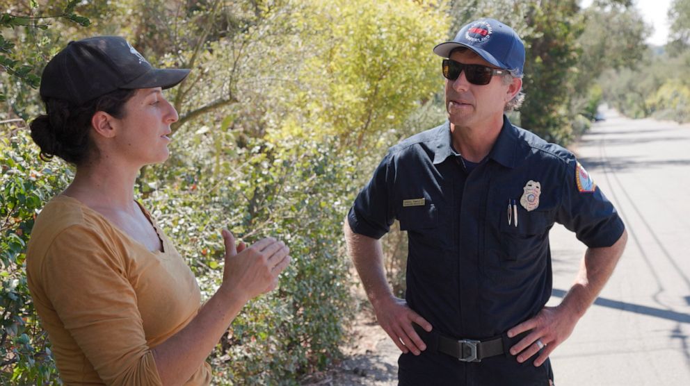 PHOTO: Jenya Schneider speaks with Daniel Fawcett, Wildland Specialist for the Carpinteria-Summerland Fire Protection District, about drought conditions in California.