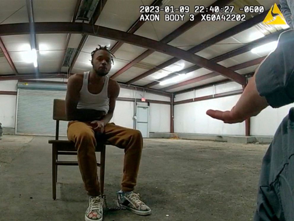 PHOTO: In this image from Baton Rouge Police Department body camera video, officers interact with Jeremy Lee inside a warehouse in Baton Rouge, on Jan. 9, 2023.