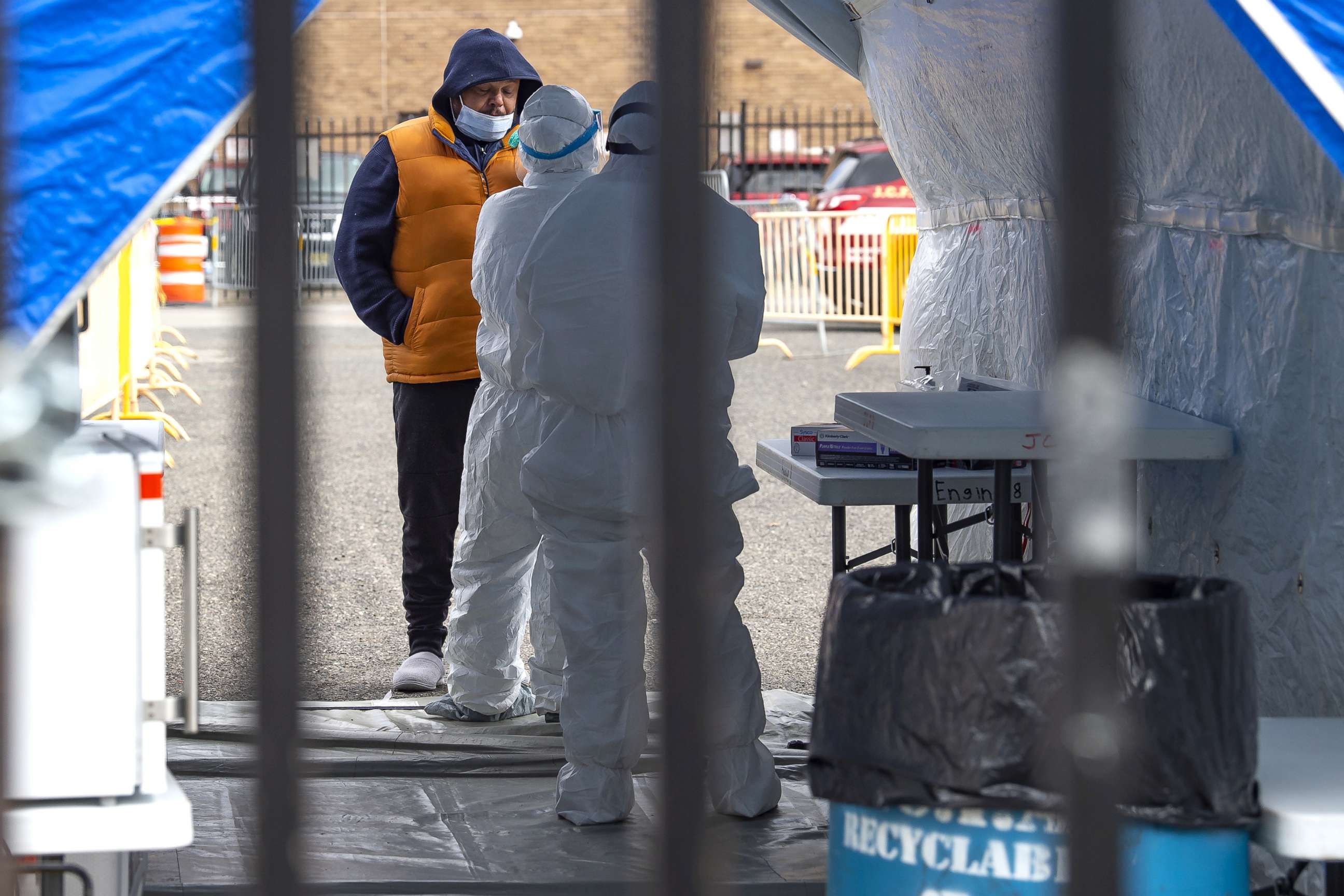 PHOTO: A man is tested by a doctor in protective gear at The Covid-19 testing site on Marin Boulevard in Jersey City, New Jersey, April 2, 2020.