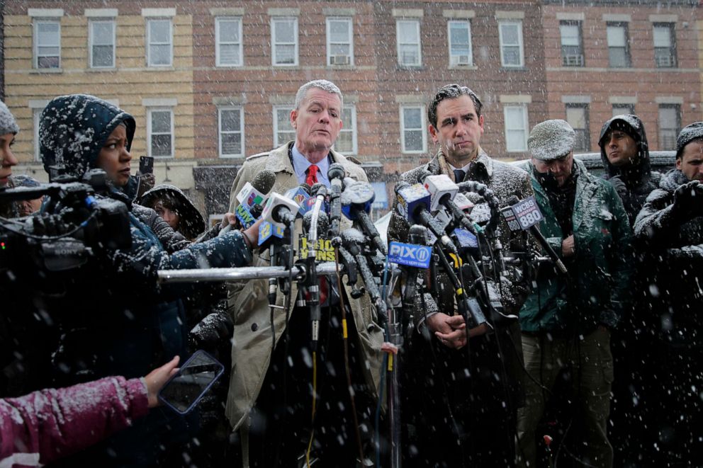 PHOTO: Jersey City's mayor Steven Fulop, right, and the Director of Public Safety James Shea talk to reporters across the street from a kosher supermarket in Jersey City, N.J., Dec. 11, 2019.