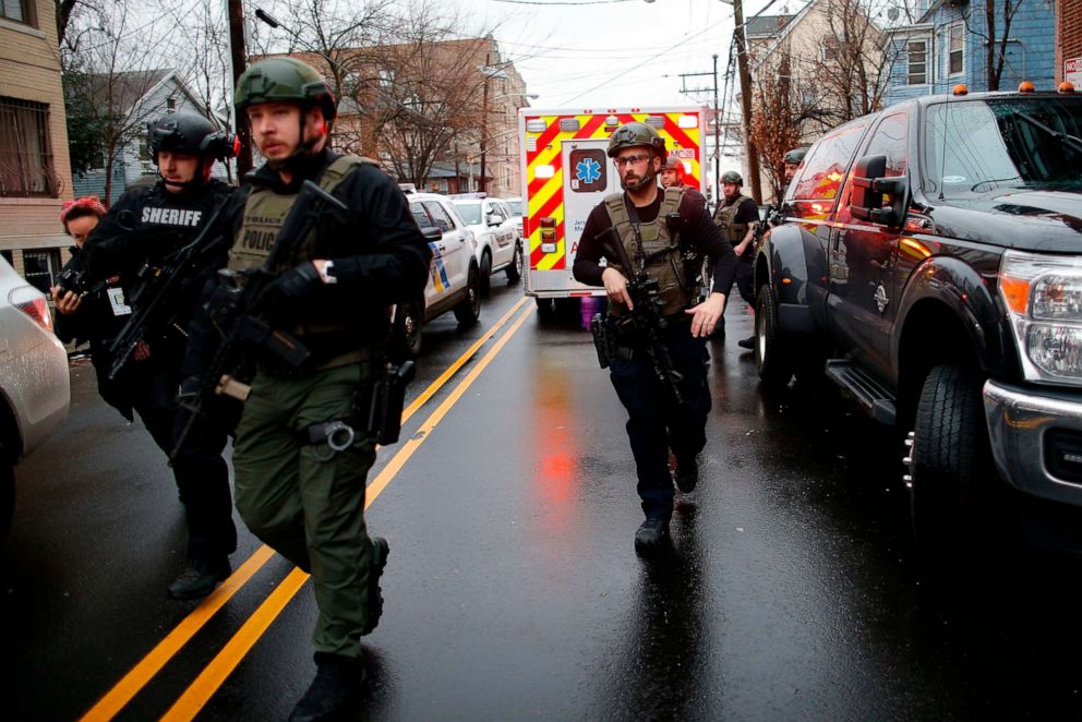 PHOTO: Police officers arrive at the scene following reports of gunfire, Tuesday, Dec. 10, 2019, in Jersey City, N.J.