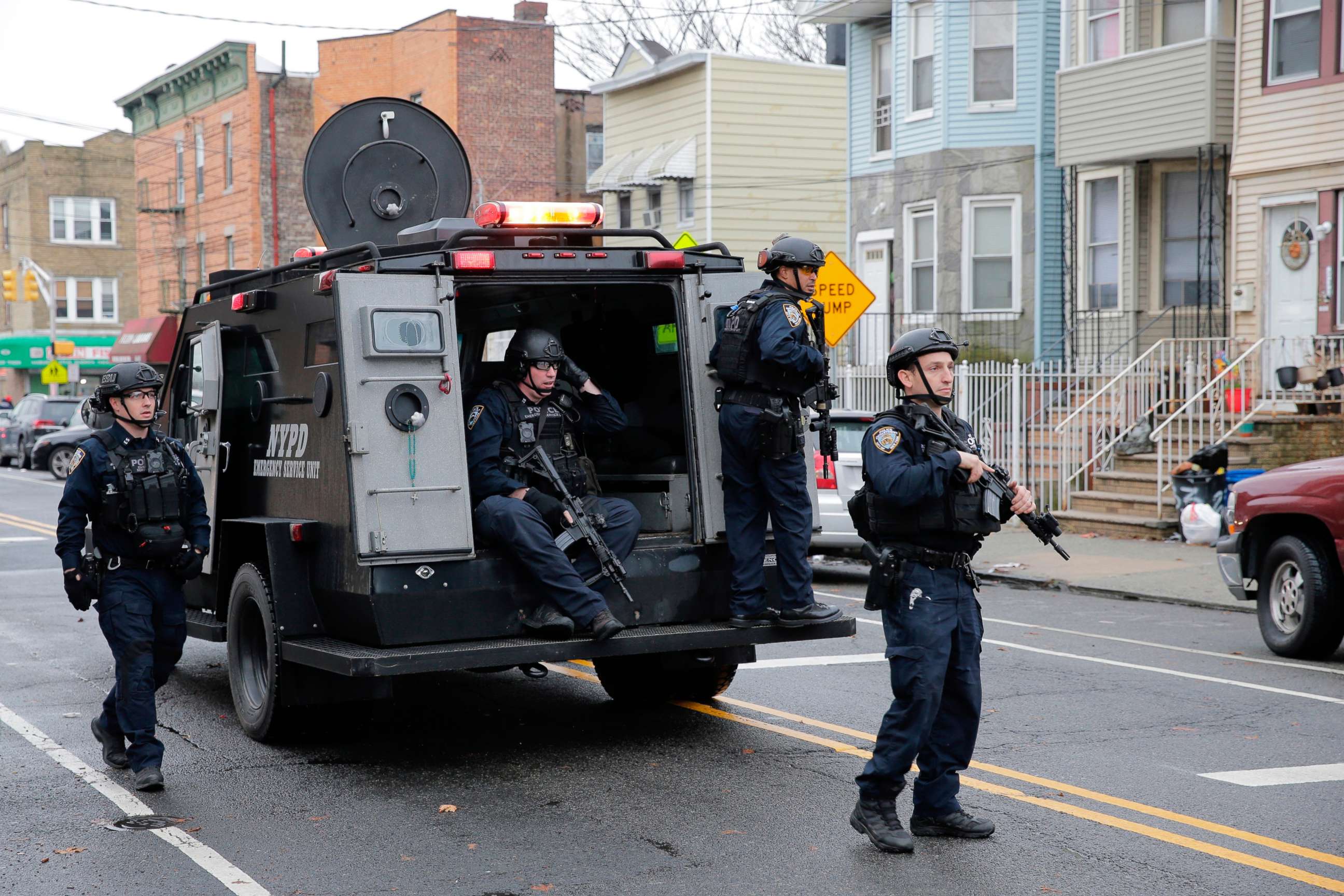PHOTO: FILE - In this Dec. 10, 2019, file photo, New York City Police officers arrive on the scene of a fatal shooting in Jersey City, N.J. Jersey City.