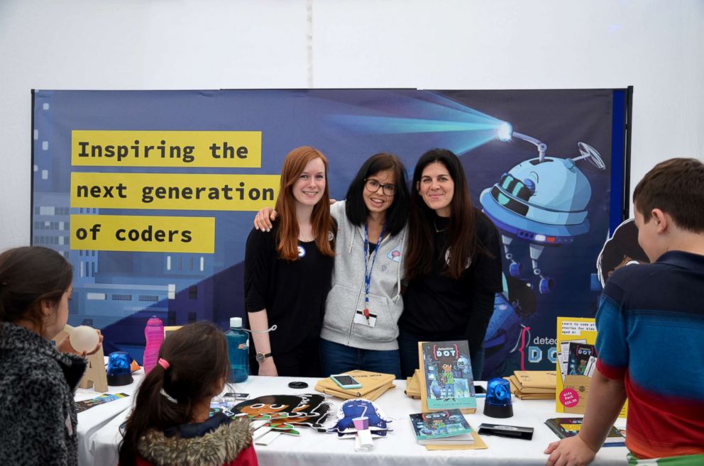 PHOTO: Jess Wade, center, attends a coding event with fellow peers.