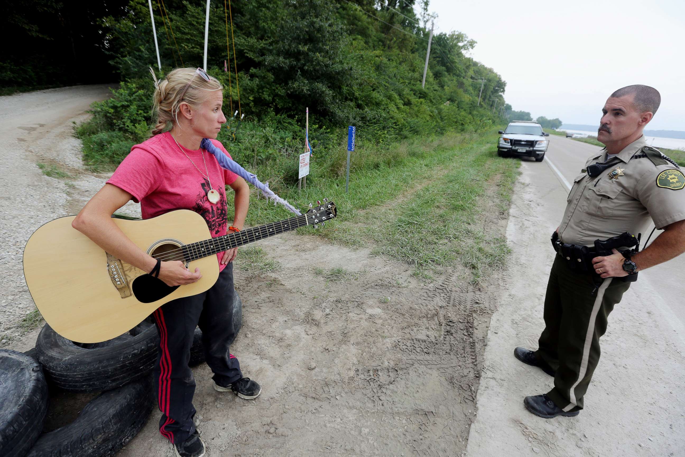 PHOTO: In this Aug. 30, 2016, file photo, activist Jessica Reznicek talks with Lee County Sheriff's Deputy Steve Sproul while conducting a personal occupation and protesting the Bakken pipeline, at a pipeline construction site, near Keokuk, Iowa.