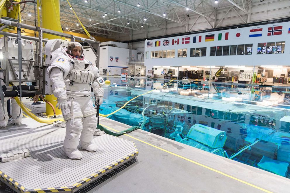 PHOTO: 2017 NASA astronaut candidate Jessica Watkins prepares to be submerged in the water for underwater spacewalk training at NASA Johnson Space Center’s Neutral Buoyancy Laboratory in Houston, July 18, 2018.