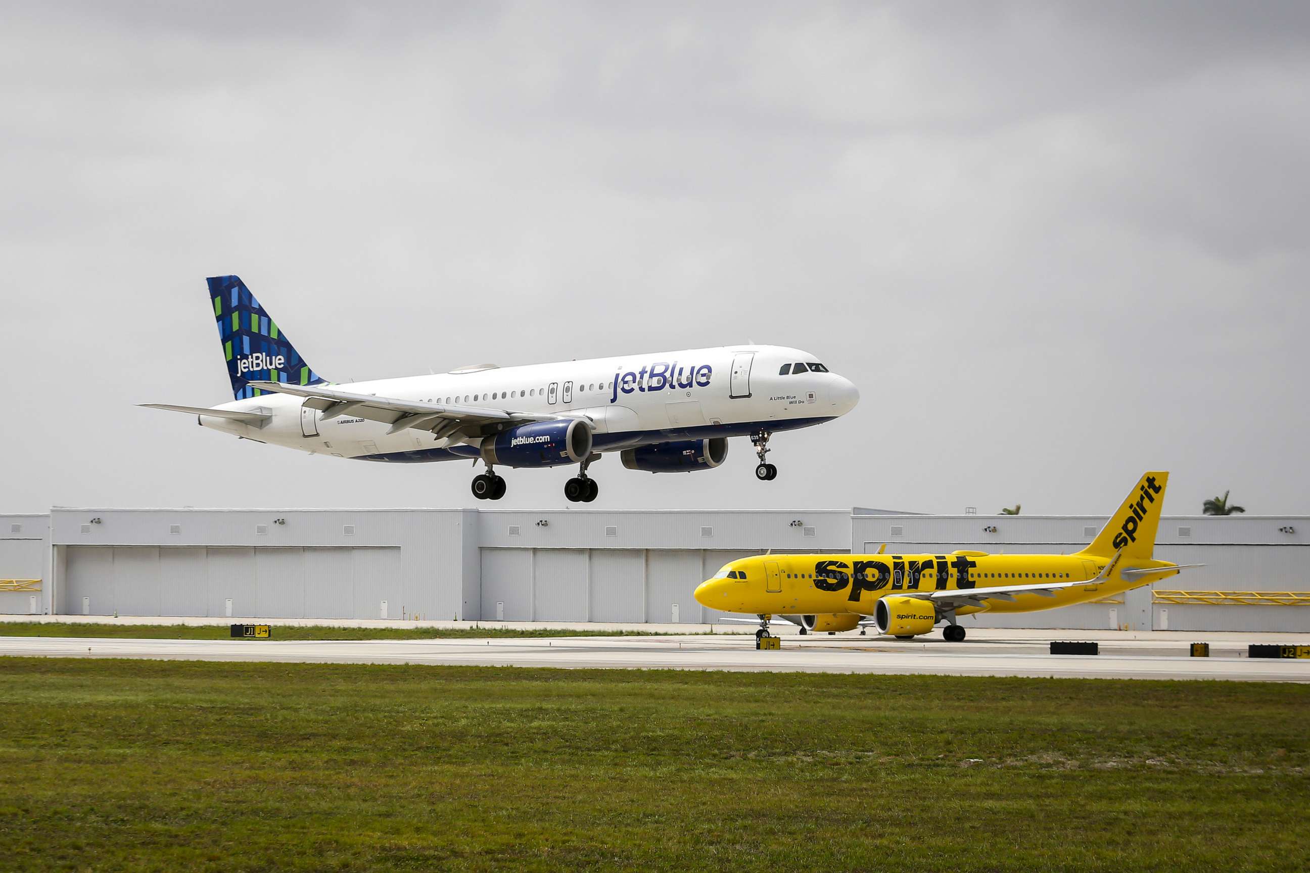 PHOTO: JetBlue and Spirit airplanes at Fort Lauderdale-Hollywood International Airport in Fort Lauderdale, Fla., May 21, 2022.