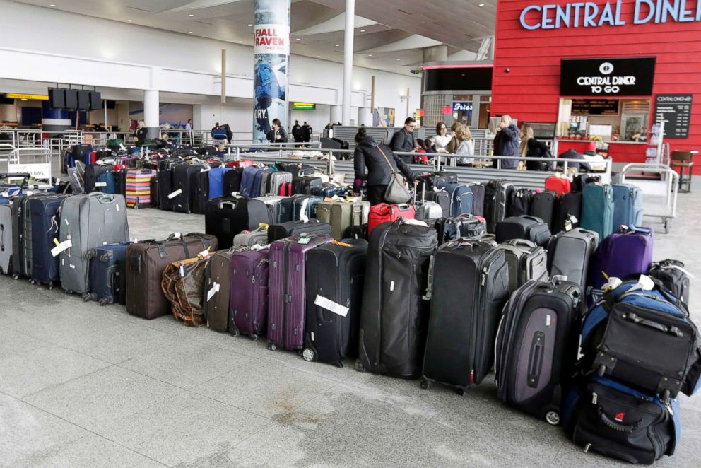 PHOTO: A woman looks through unclaimed baggage at New York's John F. Kennedy Airport Terminal 4, Jan. 8, 2018. 