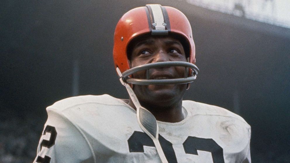 PHOTO: American football player, running back Jim Brown, #32 of the Cleveland Browns, stands on the field during a game.