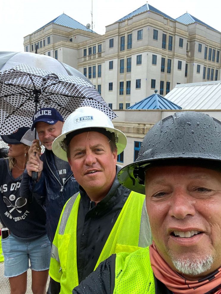 PHOTO: On Monday, Jim Tally used his company Newport Builders’ mechanical lift, raising him to the fifth floor of the hospital where his wife was staying.