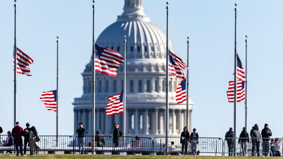 PHOTO: U.S. flags, backdropped by the U.S. Capitol, fly at half-staff following the death of former President Jimmy Carter, in Washington, Dec. 30, 2024.