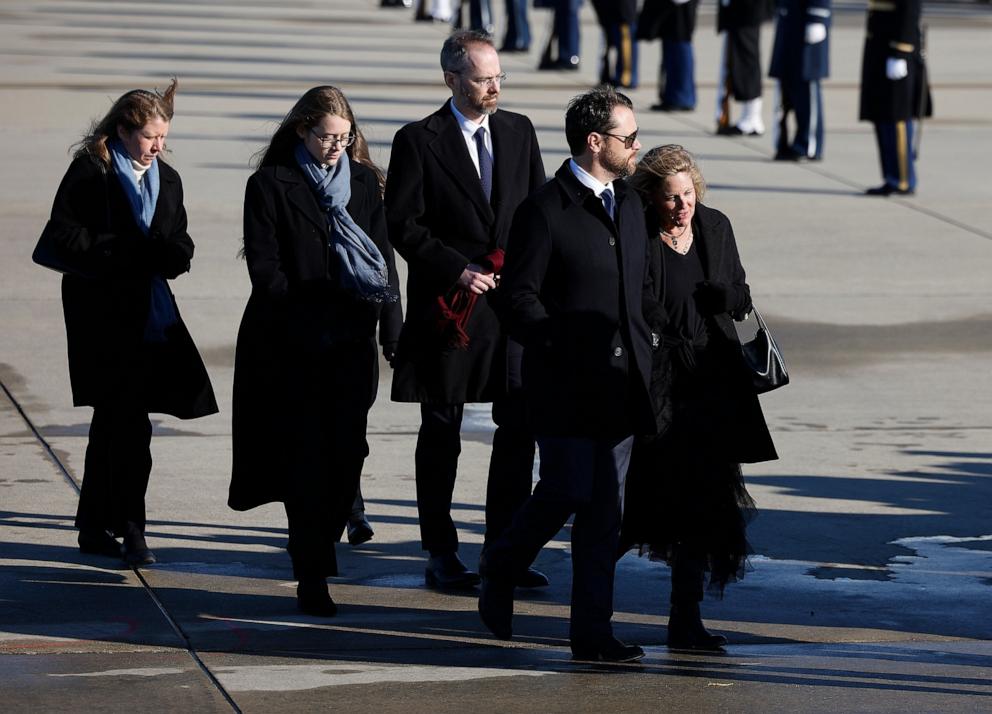 PHOTO: Members of former President Jimmy Carter's family including his grandson Jason Carter (2nd-R) and wife Kate depart Special Air Mission 39 as his casket is transferred to a hearse, Jan. 7, 2025, in Joint Base Andrews, Maryland. 