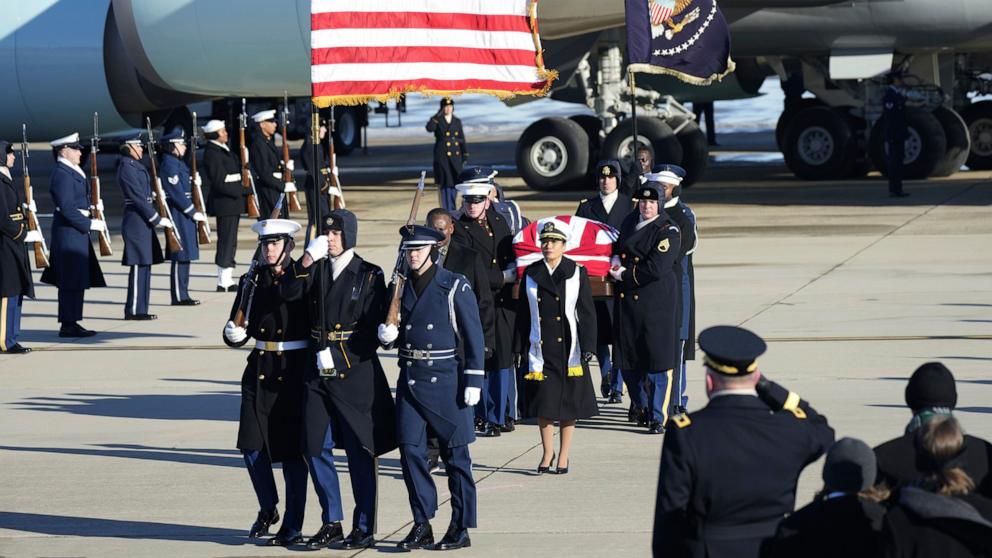 PHOTO: A joint services military body bearer team carries the flag-draped casket of former President Jimmy Carter on arrival at Joint Base Andrews, Md., Jan. 7, 2025.