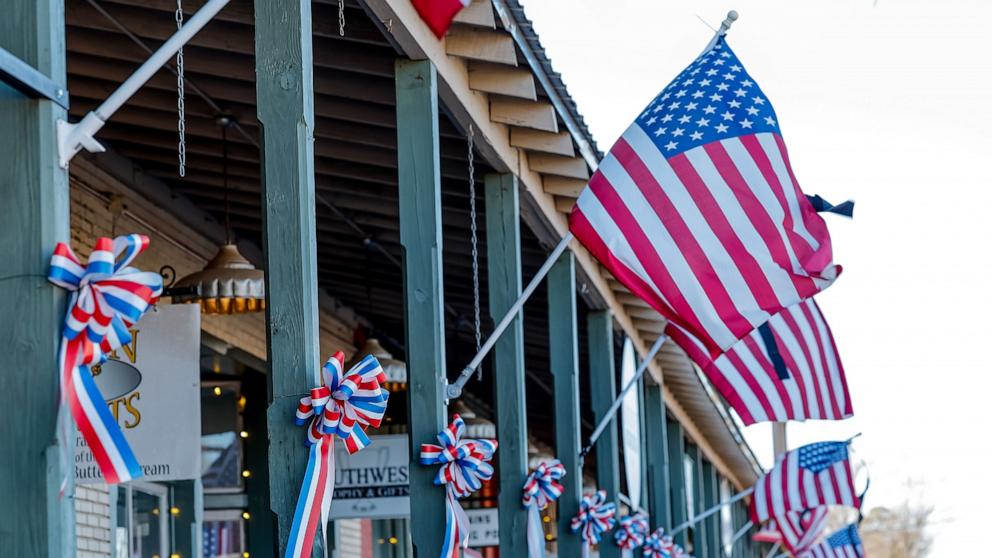 PHOTO: U.S. flags and patriotic ribbons hang in the small-town downtown one day after the death of former US President Jimmy Carter, in his hometown of Plains, Georgia, Dec. 30,2024. 