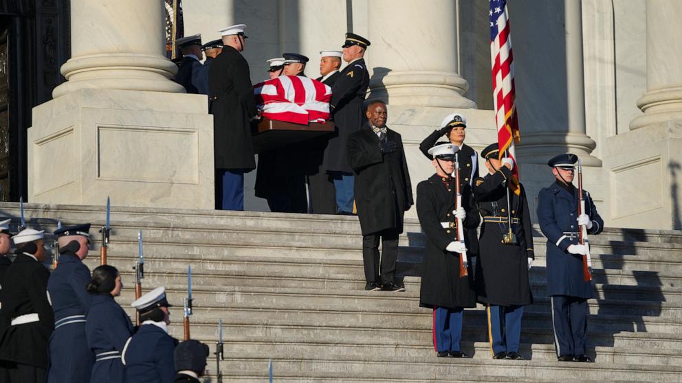 PHOTO: The flag-draped casket of former U.S. President Jimmy Carter is carried by a joint services military honor guard down the steps of the U.S. Capitol in Washington, January 9, 2025.
