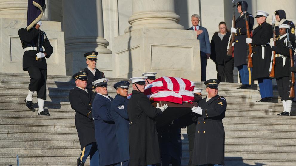 PHOTO: The flag-draped casket of former U.S. President Jimmy Carter is carried by a joint services military honor guard down the steps of the U.S. Capitol in Washington, January 9, 2025.