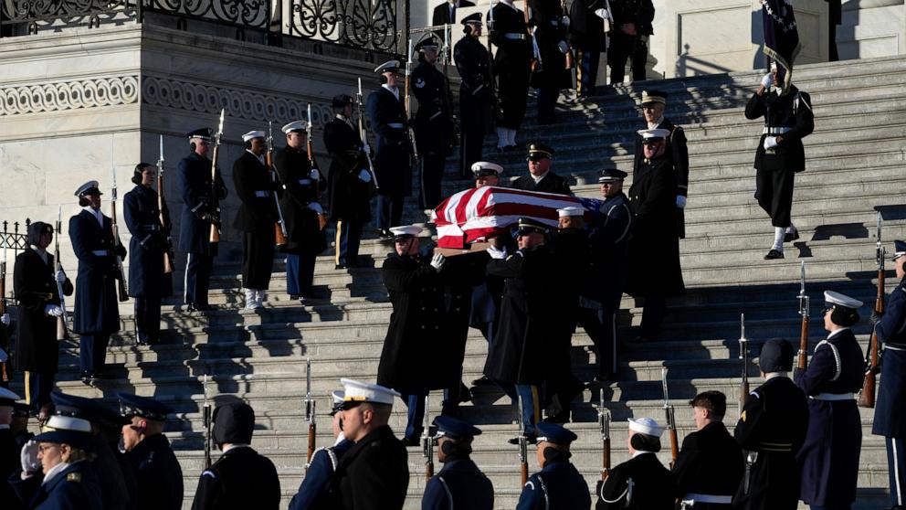 PHOTO: The flag-draped casket of former U.S. President Jimmy Carter is carried by a joint services military honor guard down the steps of the U.S. Capitol in Washington, January 9, 2025.
