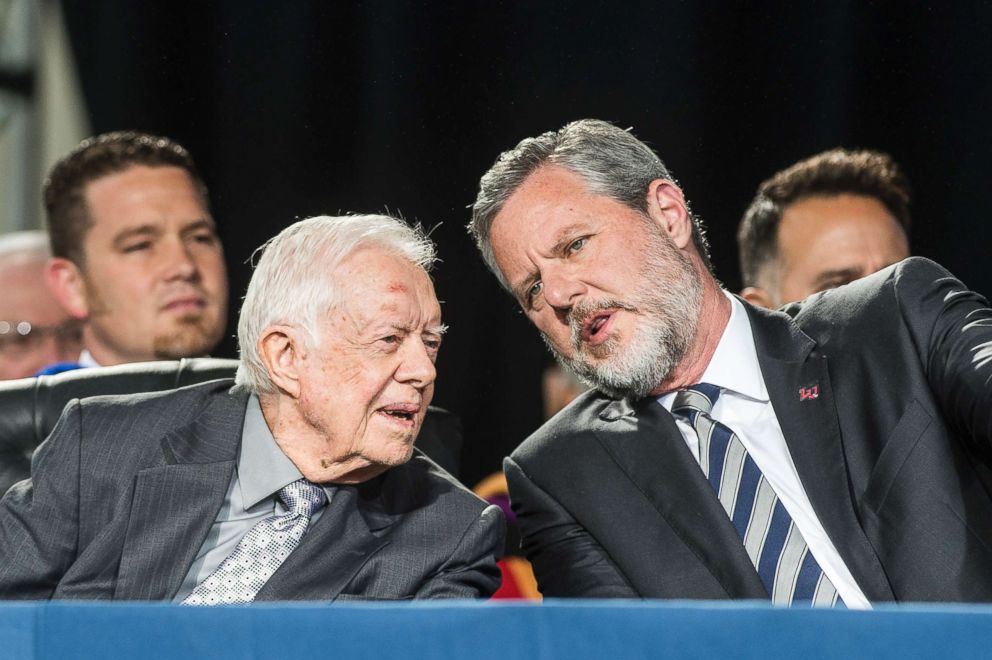 PHOTO: Former President Jimmy Carter talks with Liberty University president Jerry Falwell Jr. during the 45th commencement ceremony at Liberty, May 19, 2018, in Lynchburg, Va.