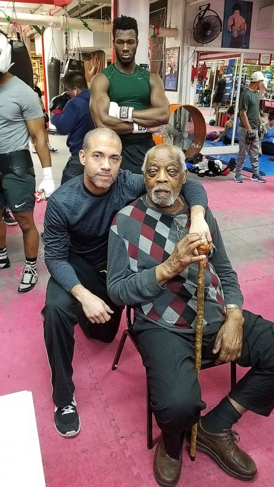 PHOTO: Boxing trainer and co-owner of "Jimmy's Corner" in Times Square Jimmy Glenn with his son Adam Glenn. Jimmy Glenn, 89, died from the coronavirus on May 7.