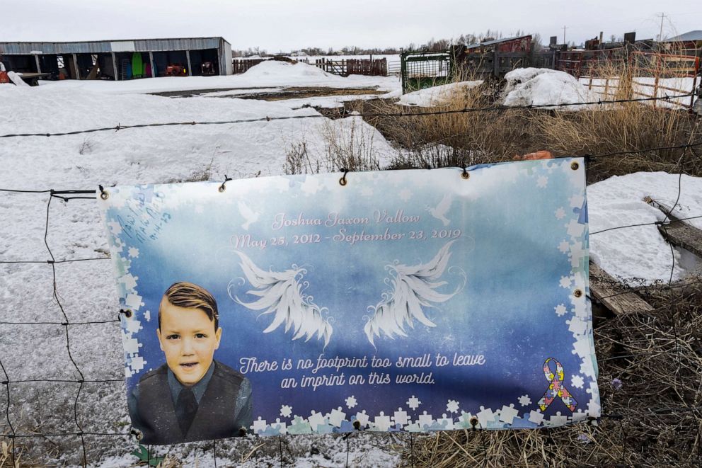 PHOTO: A picture of J.J. Vallow is part of a memorial to him, hung on fence opposite the property where his body was found in 2020, on April 4, 2023 near Rexburg, Idaho.