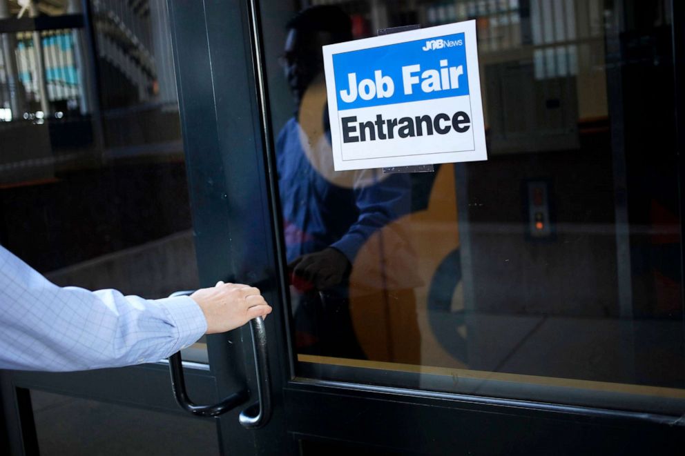 PHOTO: In this June 23, 2021, file photo, a job seeker arrives at a Job News USA career fair in Louisville, Ky.