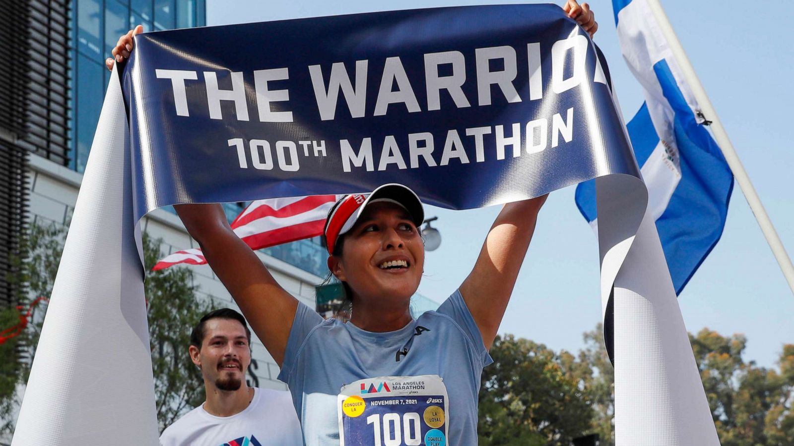 PHOTO: Jocelyn Rivas holds aloft a finish line tape after completing the Los Angeles Marathon, Nov. 7, 2021.