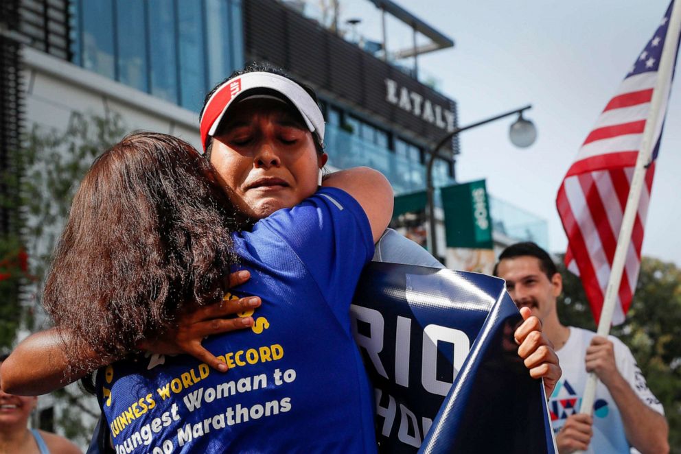 PHOTO: Jocelyn Rivas is hugged by her mother, Rosa after completing the Los Angeles Marathon, Nov. 7, 2021.