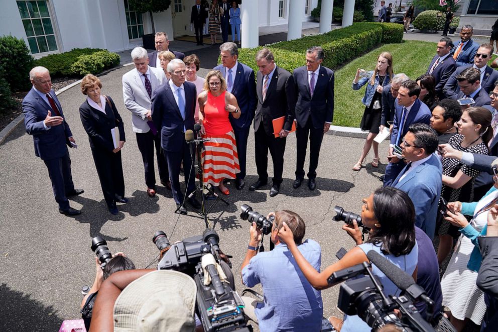 PHOTO: President Joe Biden, with a bipartisan group of Senators, speaks Thursday June 24, 2021, outside the White House in Washington.