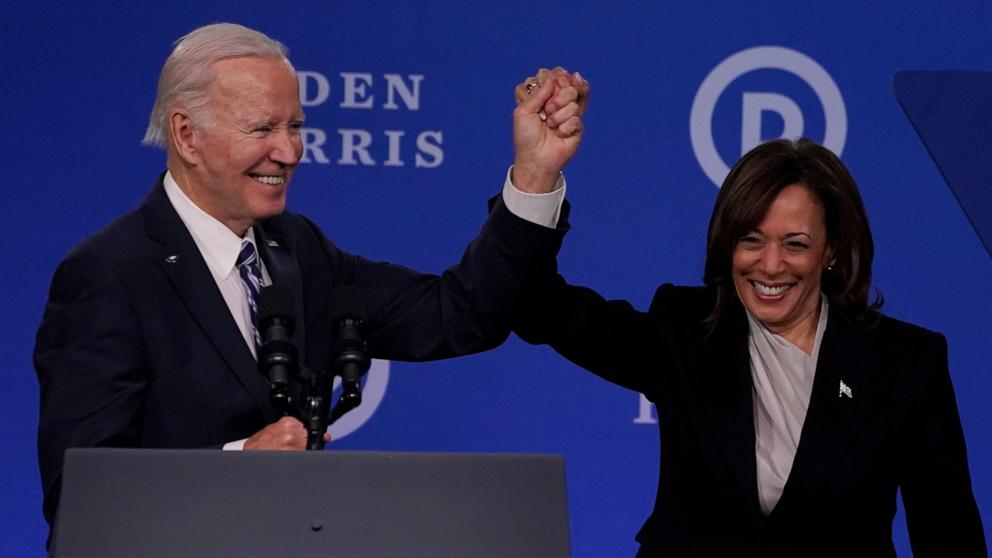 PHOTO: Vice President Kamala Harris and President Joe Biden hold hands at the Democratic National Committee 2023 Winter meeting in Philadelphia, Pennsylvania, February 3, 2023.