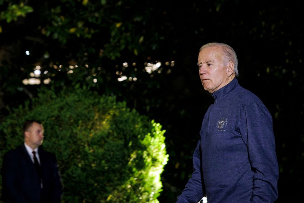 PHOTO: President Joe Biden walks to the White House after landing on the South Lawn aboard Marine One, May 21, 2023 in Washington, DC.
