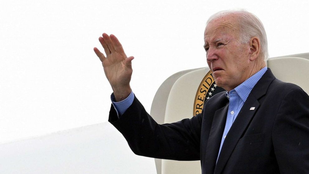 PHOTO: President Joe Biden waves while boarding Air Force One at Reno-Tahoe International Airport in Reno, Nevada, Aug. 21, 2023, as he departs for Hawaii.