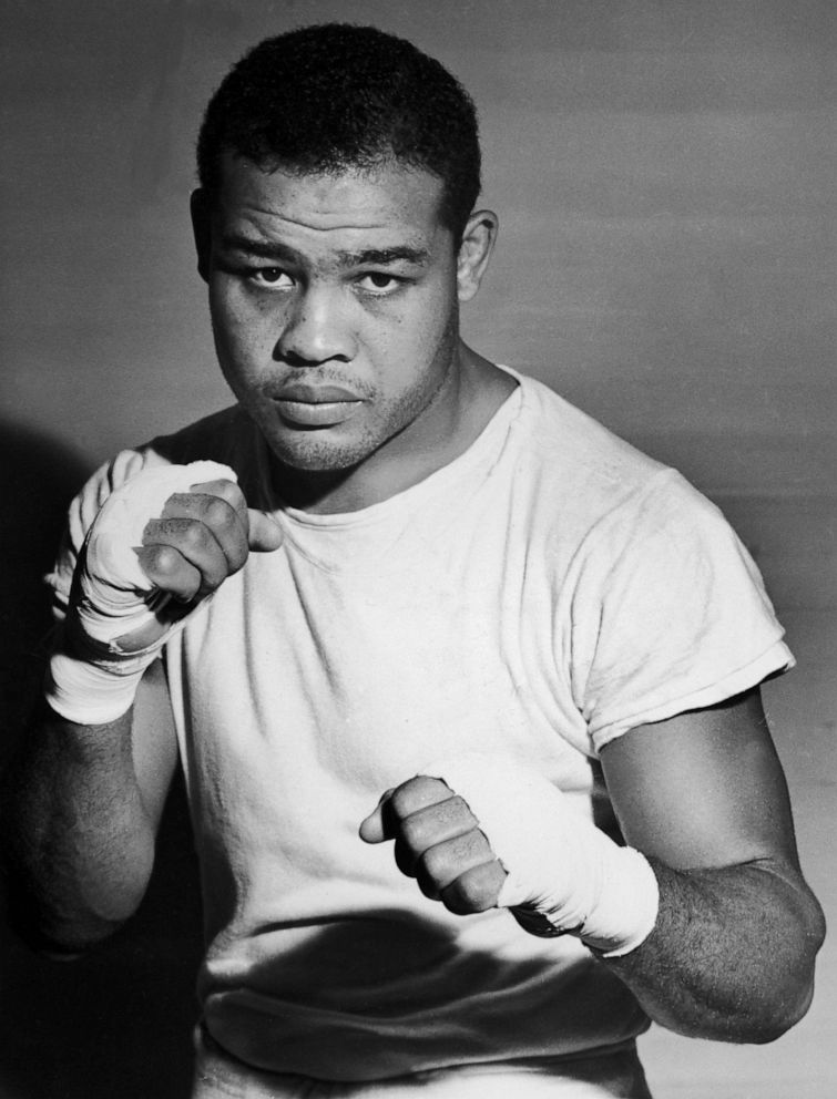 Boxer Joe Louis Wearing Boxing Gloves Framed Print by Bettmann