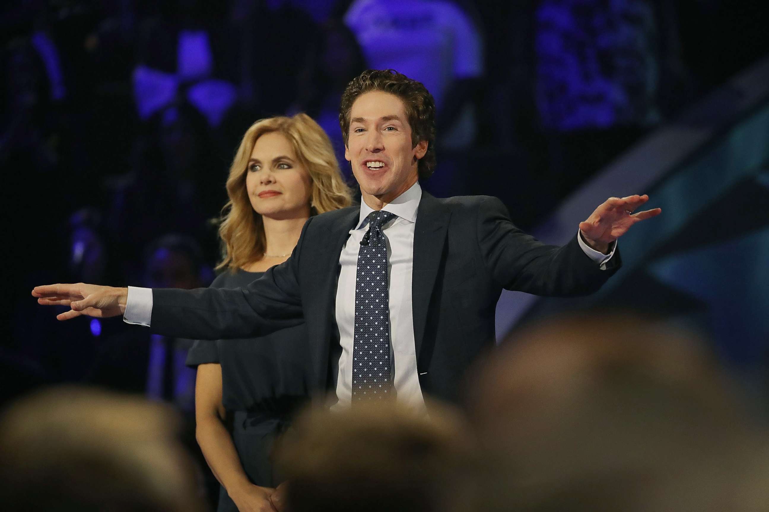 PHOTO: Joel Osteen, the pastor of Lakewood Church, stands with his wife, Victoria Osteen, as he conducts a service at his church, Sep. 3, 2017, in Houston.