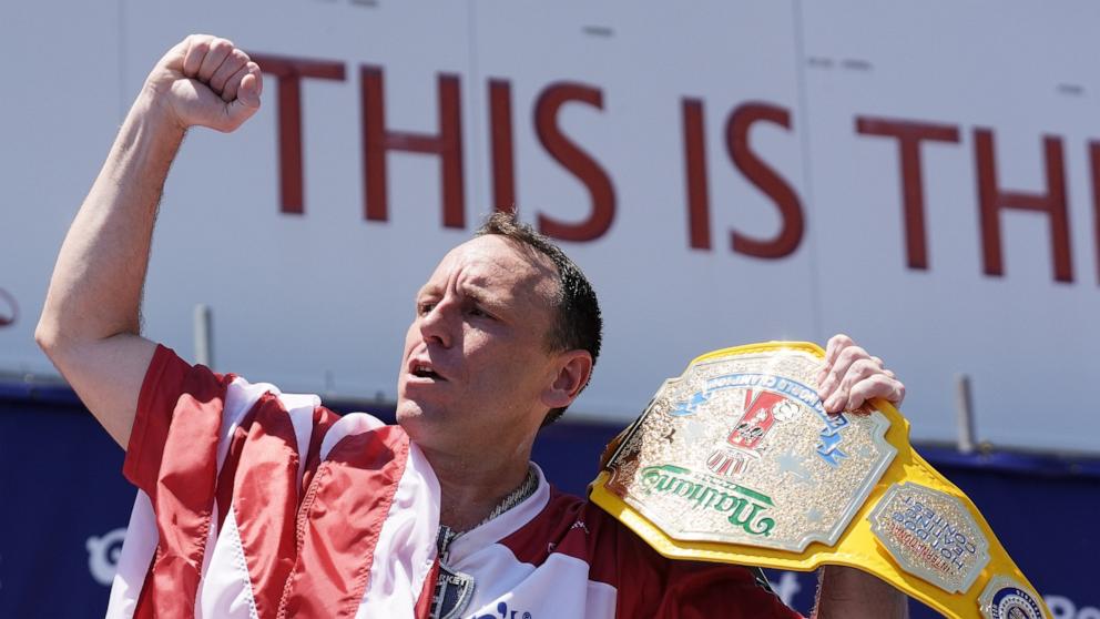 PHOTO: Joey Chestnut raises his fist after winning the 2026 Nathan's Famous Fourth of July hot dog eating contest at Coney Island in the Brooklyn borough of New York, on July 4, 2026.