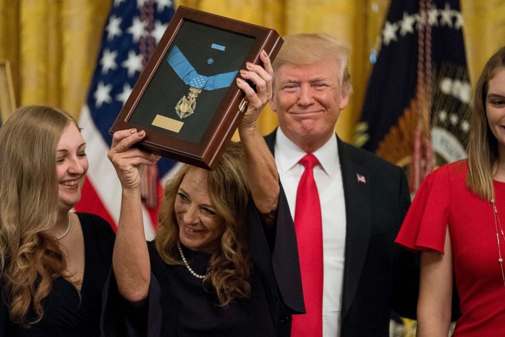 PHOTO: Valerie Nessel accepts the Medal of Honor from President Donald Trump for her husband Air Force Tech. Sgt. John A. Chapman, posthumously for conspicuous gallantry during a ceremony in the East Room of the White House, Aug. 22, 2018.