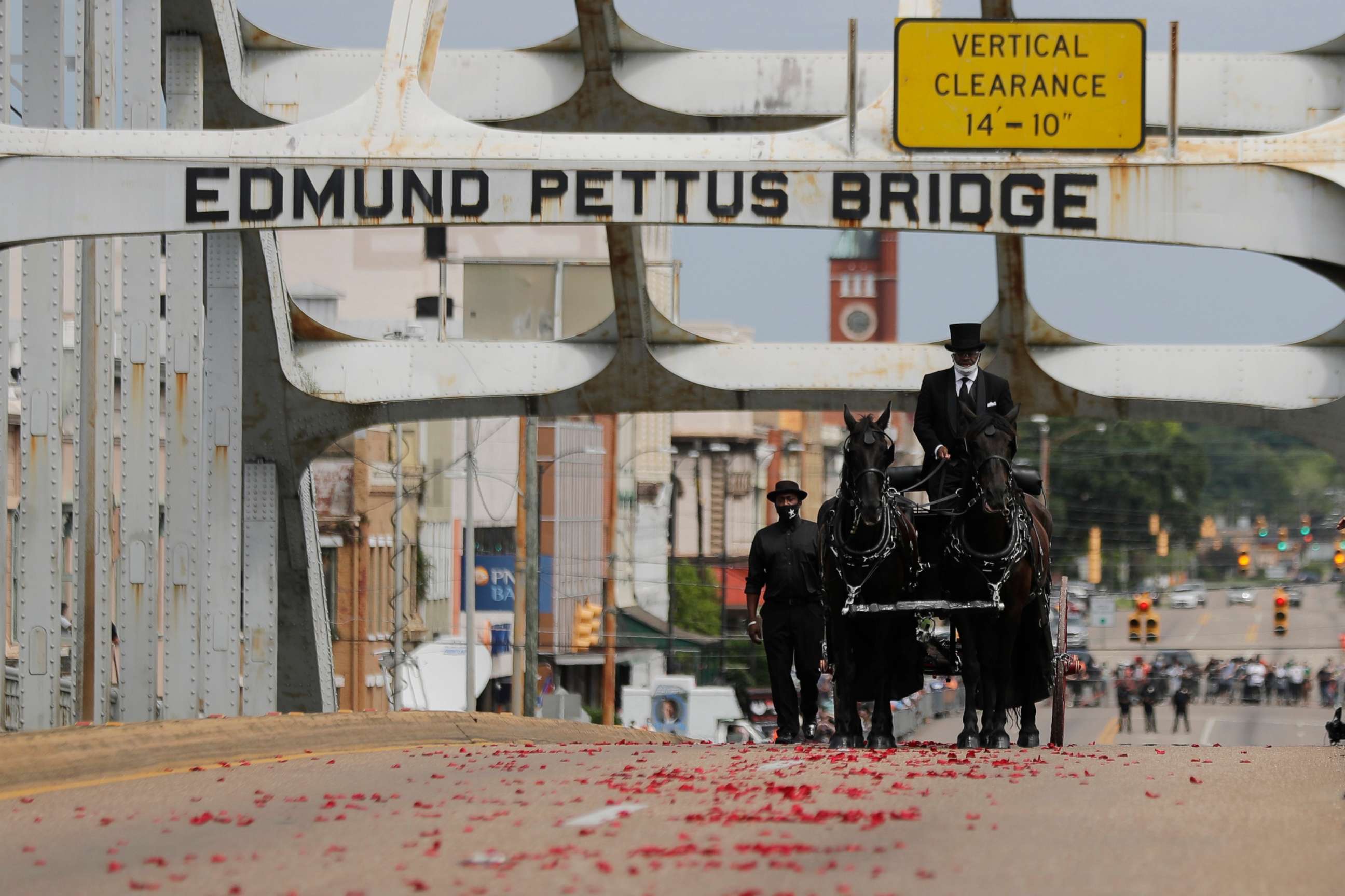 PHOTO: The casket of Rep. John Lewis moves over the Edmund Pettus Bridge by horse-drawn carriage during a memorial service for Lewis, July 26, 2020, in Selma, Ala. 