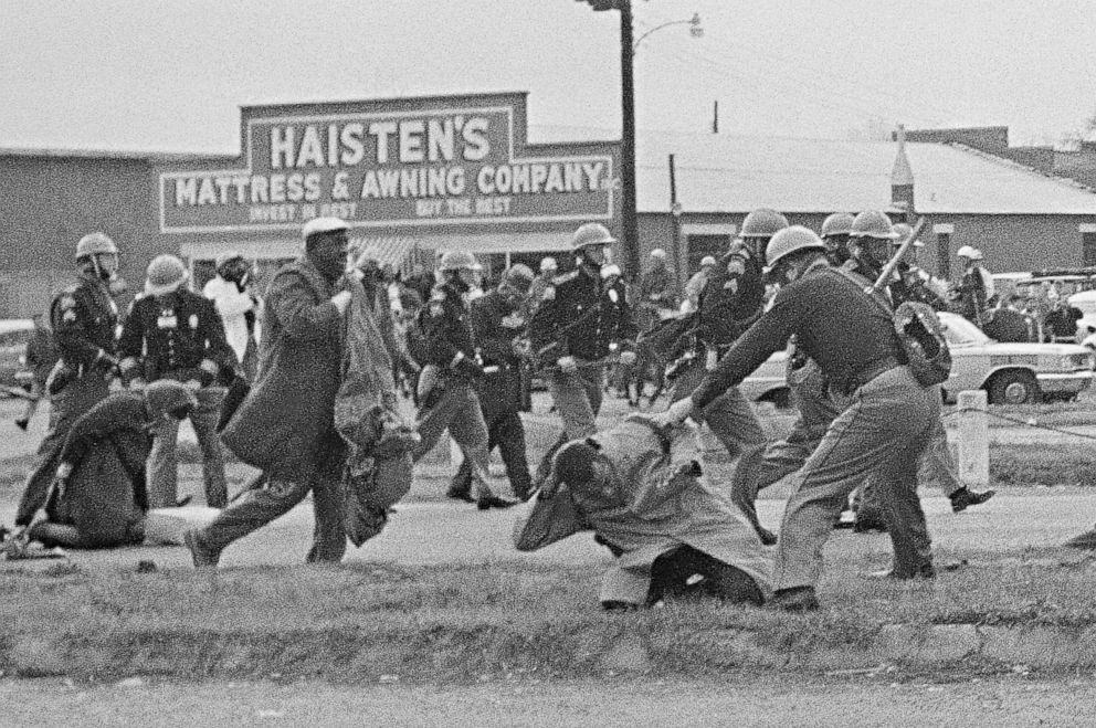 PHOTO: John Lewis, chairman of the Student Nonviolent Coordinating Committee (in the foreground) is beaten by a state trooper during a civil rights voting march in Selma, Ala., March 7, 1965.