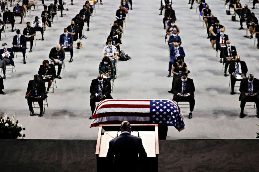 PHOTO: Rev. Darryl Caldwell speaks as the casket of the late Rep. John Lewis lies in repose during a service celebrating "The Boy from Troy" at Troy University on July 25, 2020, in Troy, Ala.