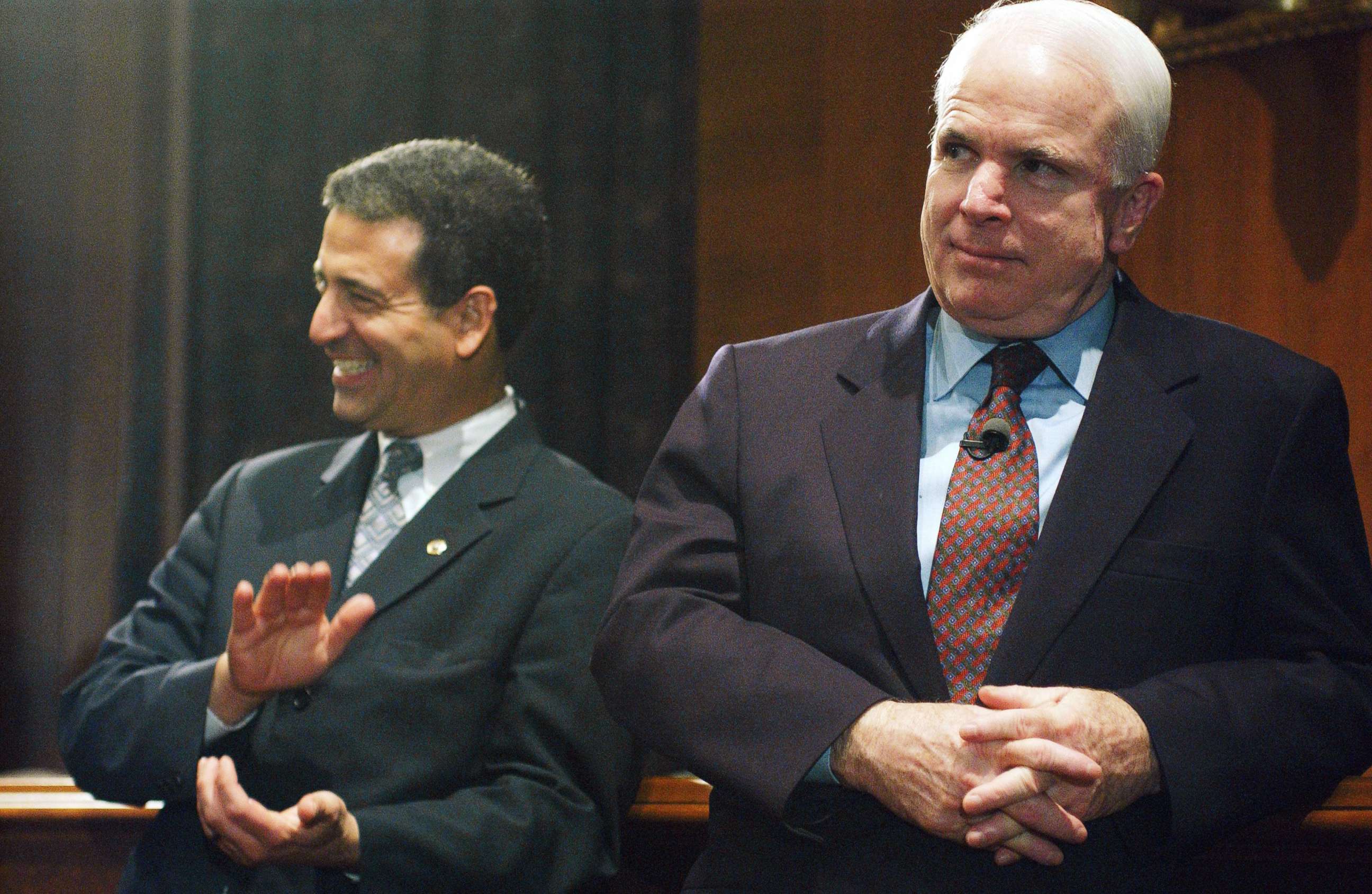 PHOTO: Sen. Russ Feingold and Sen. John McCain watch a rally in the Dirksen Senate Office Building after the cloture vote on the campaign finance reform bill on the Senate floor, March 20, 2002.