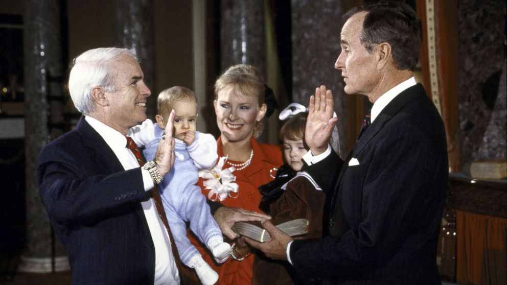 PHOTO: Vice President George H.W. Bush re-enacts the swearing in of Sen. John McCain with his wife Cindy and children Jack and Meghan in January 1987.