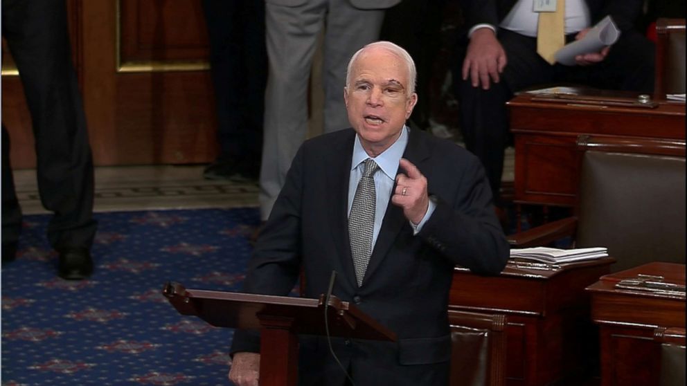 A still image from video shows U.S. Senator John McCain who had been recuperating in Arizona after being diagnosed with brain cancer, acknowledging applause as he arrives on the floor of the U.S. Senate after returning to Washington for a vote on healthcare reform in Washington, July 25, 2017.