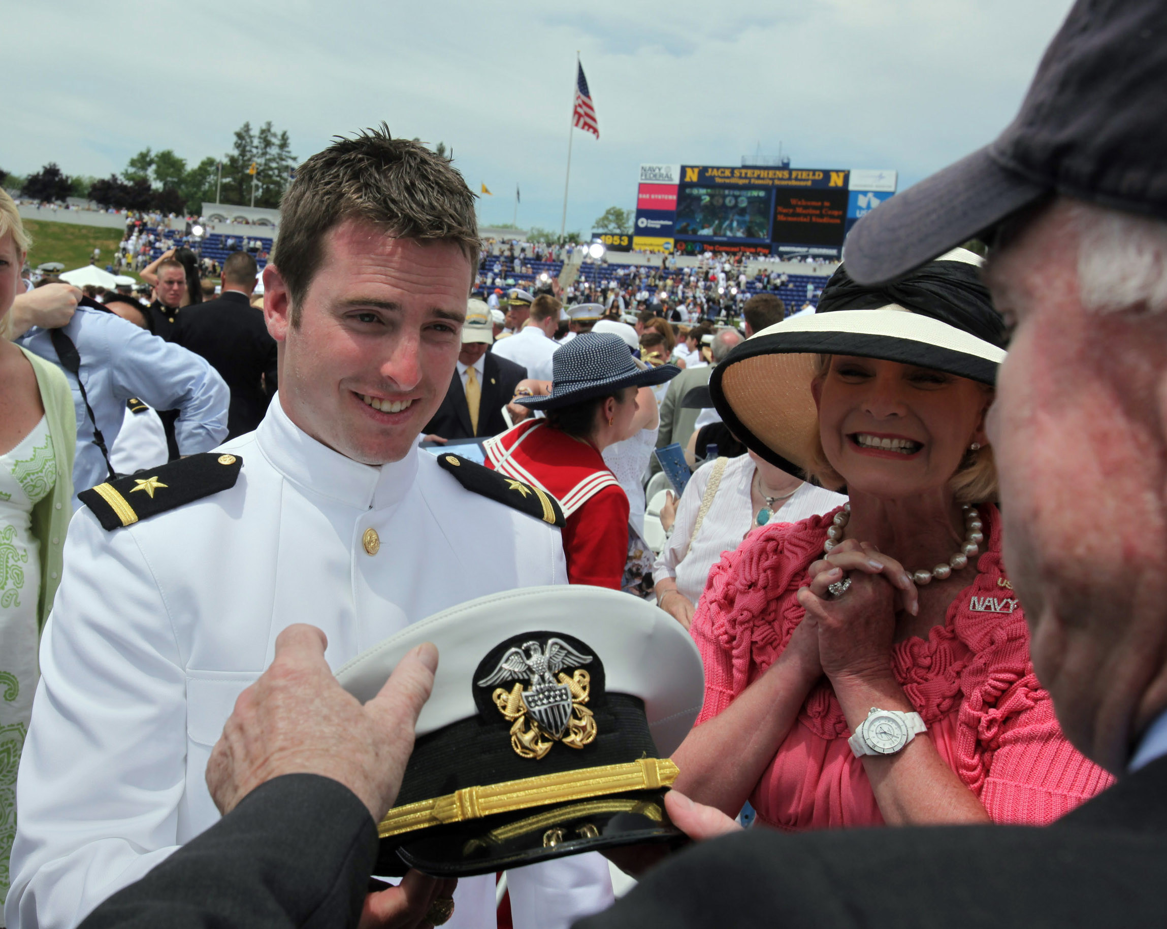 PHOTO: Jack McCain shows his cap to his parents, Sen. John McCain and Cindy McCain, at his commencement ceremony at the U.S. Naval Academy in Annapolis, Md.,  May 22, 2009.