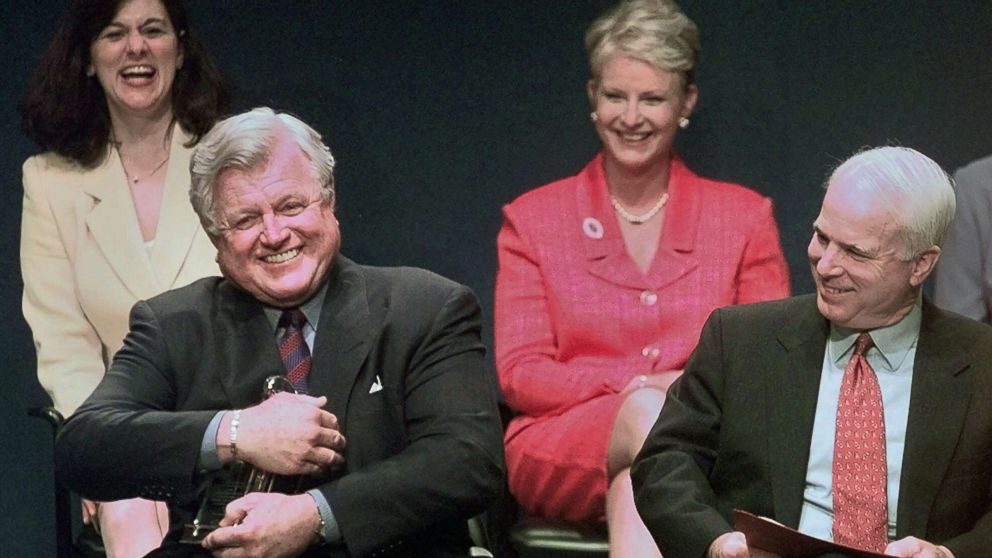 Sen. Ted Kennedy jokingly holds the Profile in Courage award as if he intends to keep it, as co-winner, Sen. John McCain, right, reacts during a ceremony at the John F. Kennedy Library in Boston, May 24, 1999.