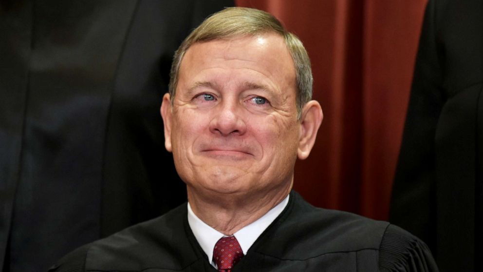 PHOTO: Chief Justice John Roberts poses for the official group photo at the US Supreme Court in Washington, DC, Nov. 30, 2018.
